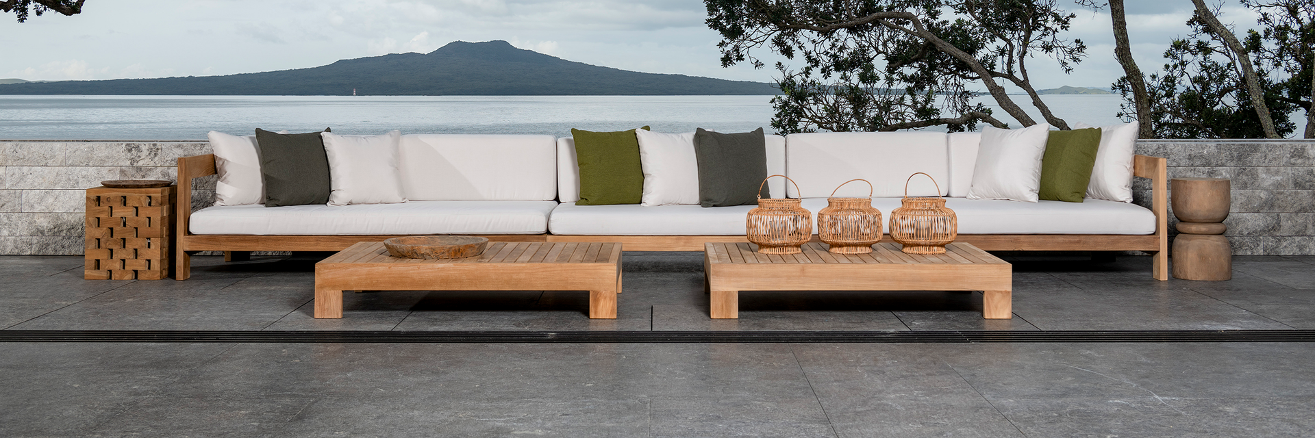 amalfi teak modular furniture collection outside by ocean