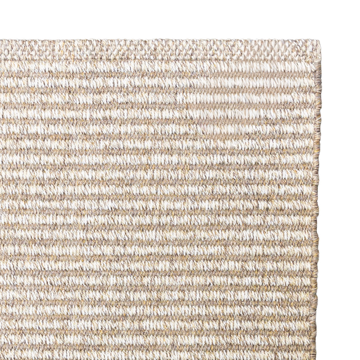 Close-up of Avela outdoor handwoven rug in natural light brown tones with a subtle linear weave pattern.