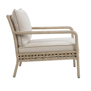 Outdoor lounge chair with beige rope-wrapped frame, open woven backrest, curved armrests and light beige seat and back cushions. Side view.