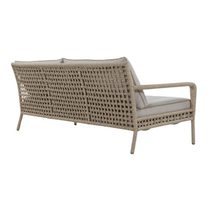 Three-seater outdoor sofa with rope-wrapped aluminium frame, open woven backrest and linen-coloured seat and back cushions. Back angle view.