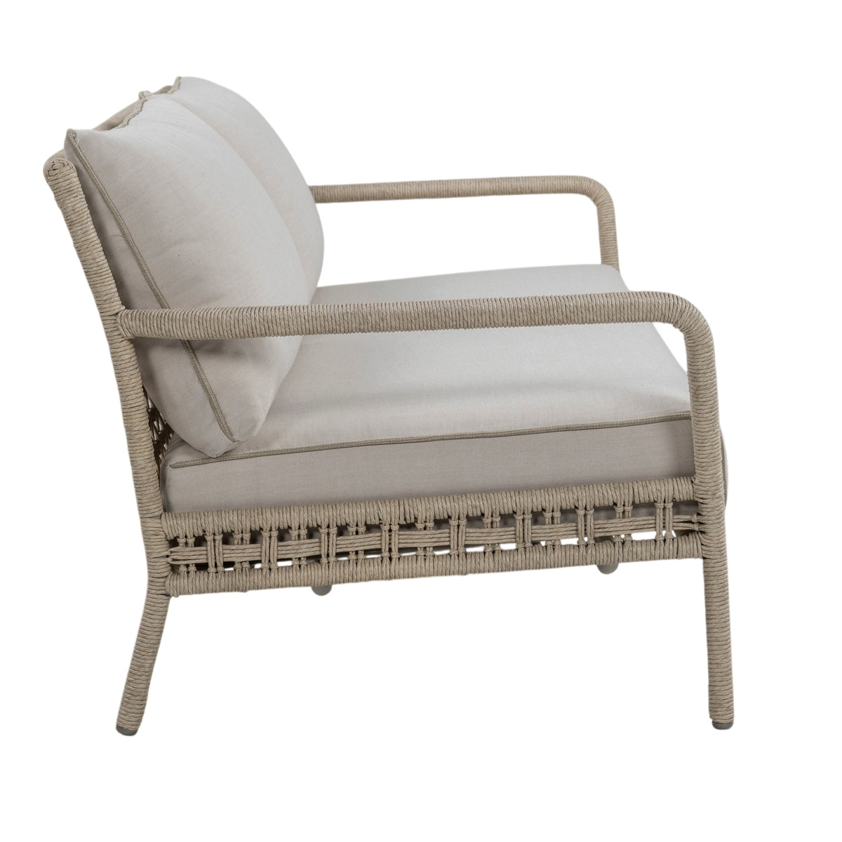 Three-seater outdoor sofa with rope-wrapped aluminium frame, open woven backrest and linen-coloured seat and back cushions. Elevated side view.