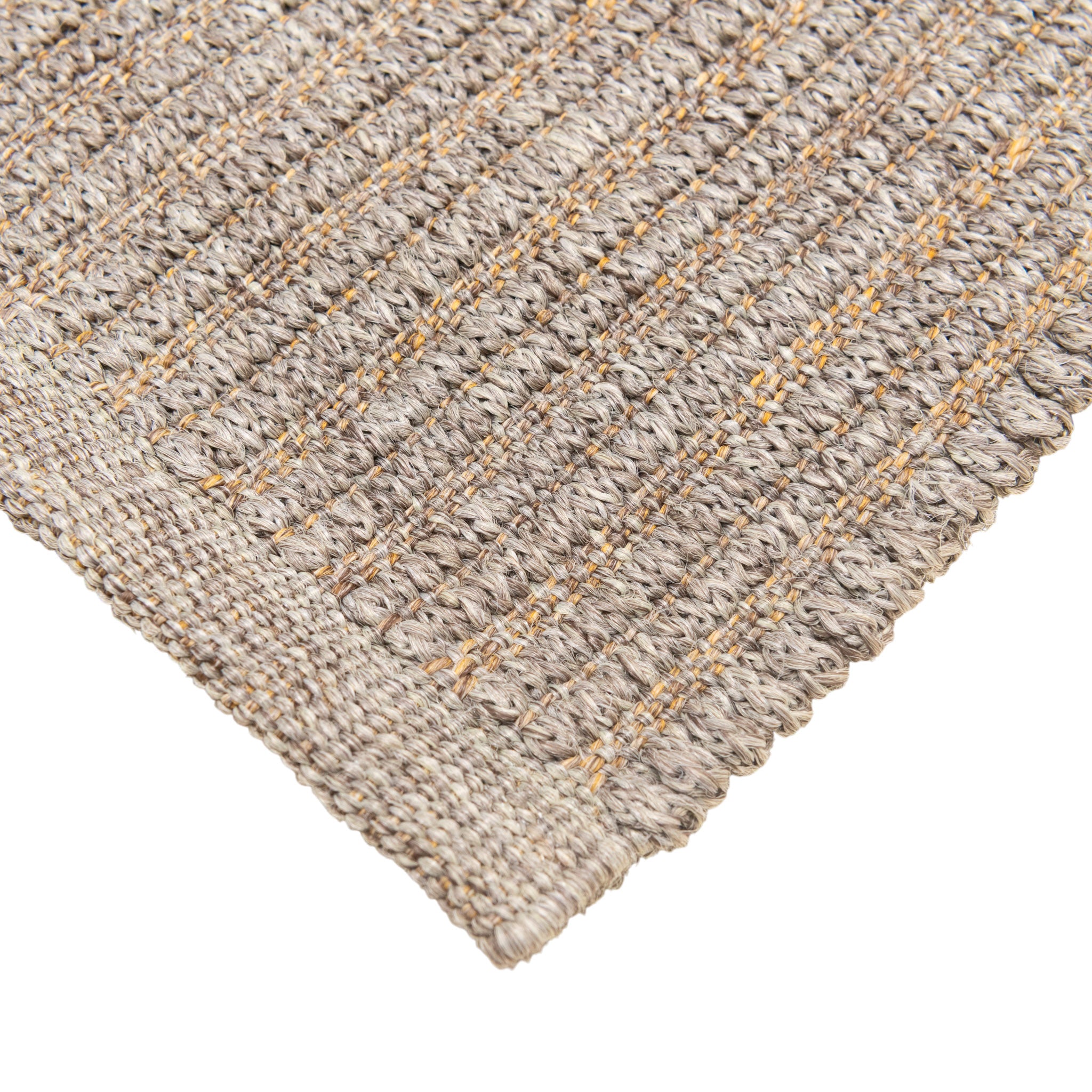 Close-up of a textured beige rug with a diamond pattern on a white background