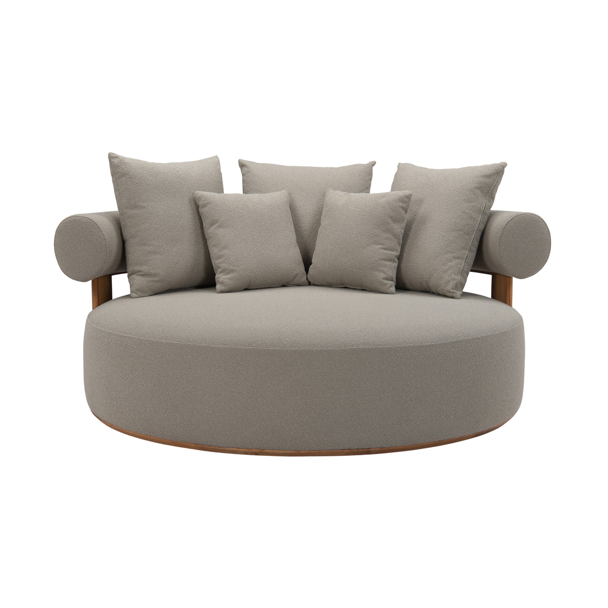 Cap Ferrat teak daybed with deep plush seating cushions and pillows. Curved back. Front view.