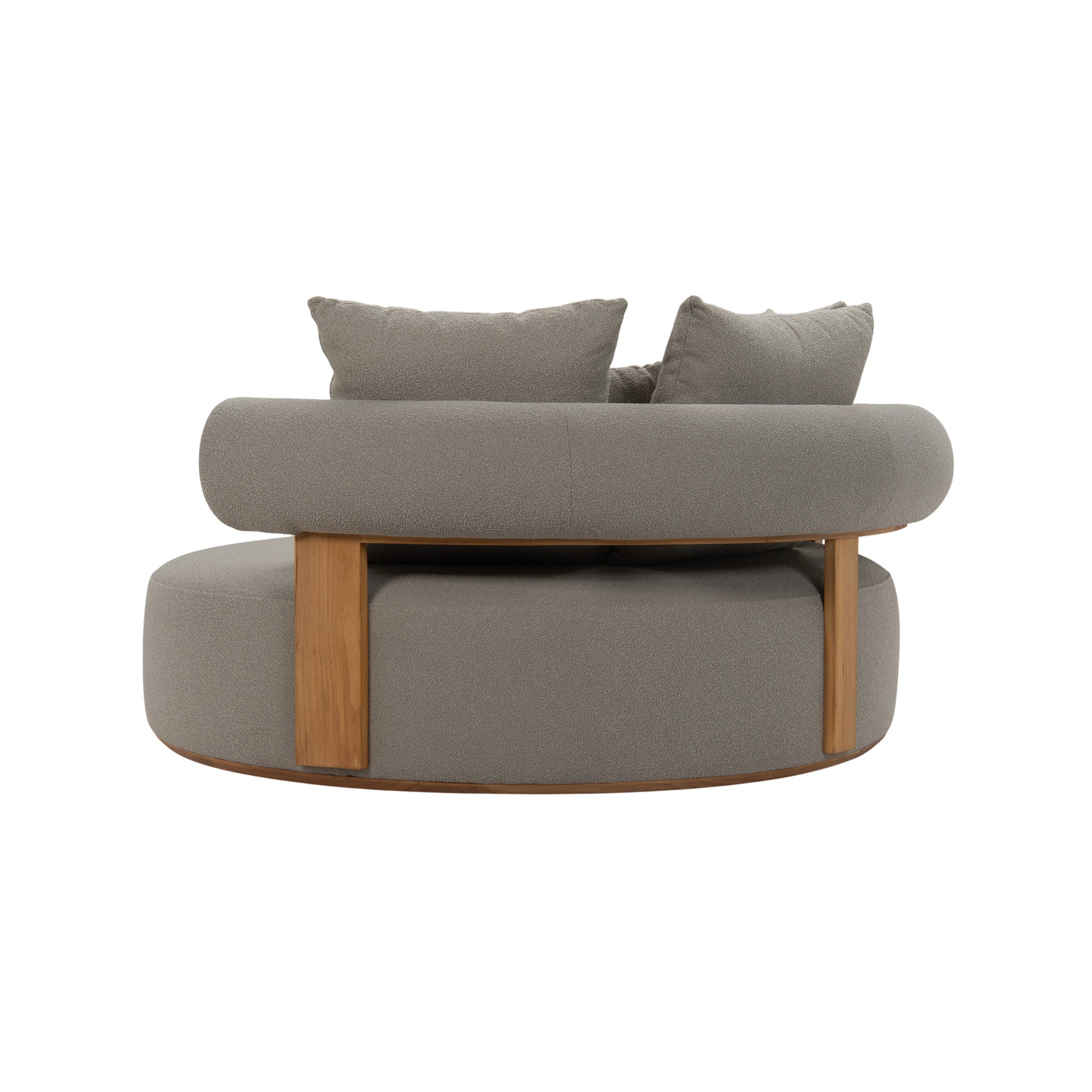 Rear angle view of large Cap Ferrat teak daybed with plush seating cushions and pillows. Unique curved teak frame.