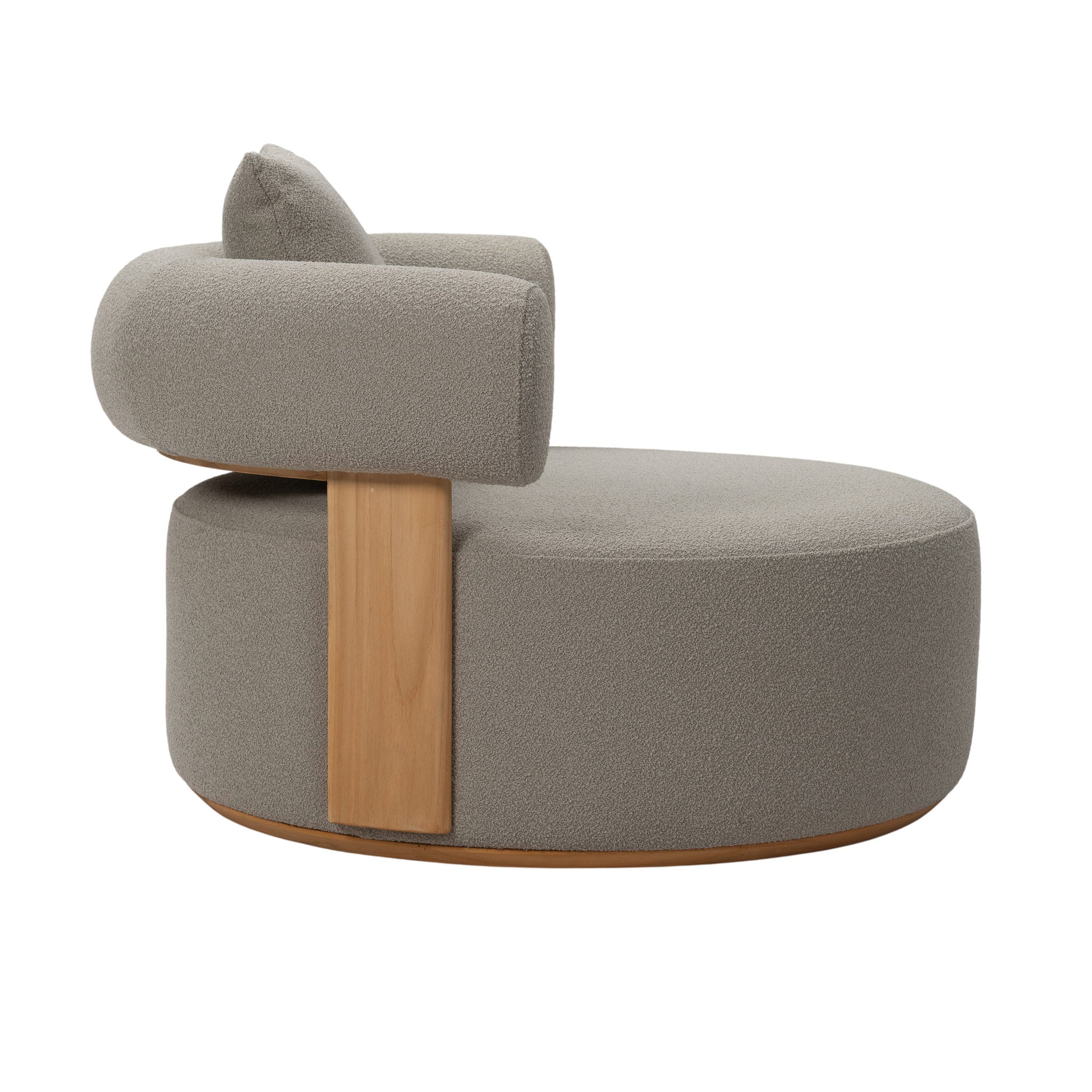 Side view of Cap Ferrat teak lounge chair featuring round seating and arm rest with plush seating cushions and backrest. Includes a pillow cushion.