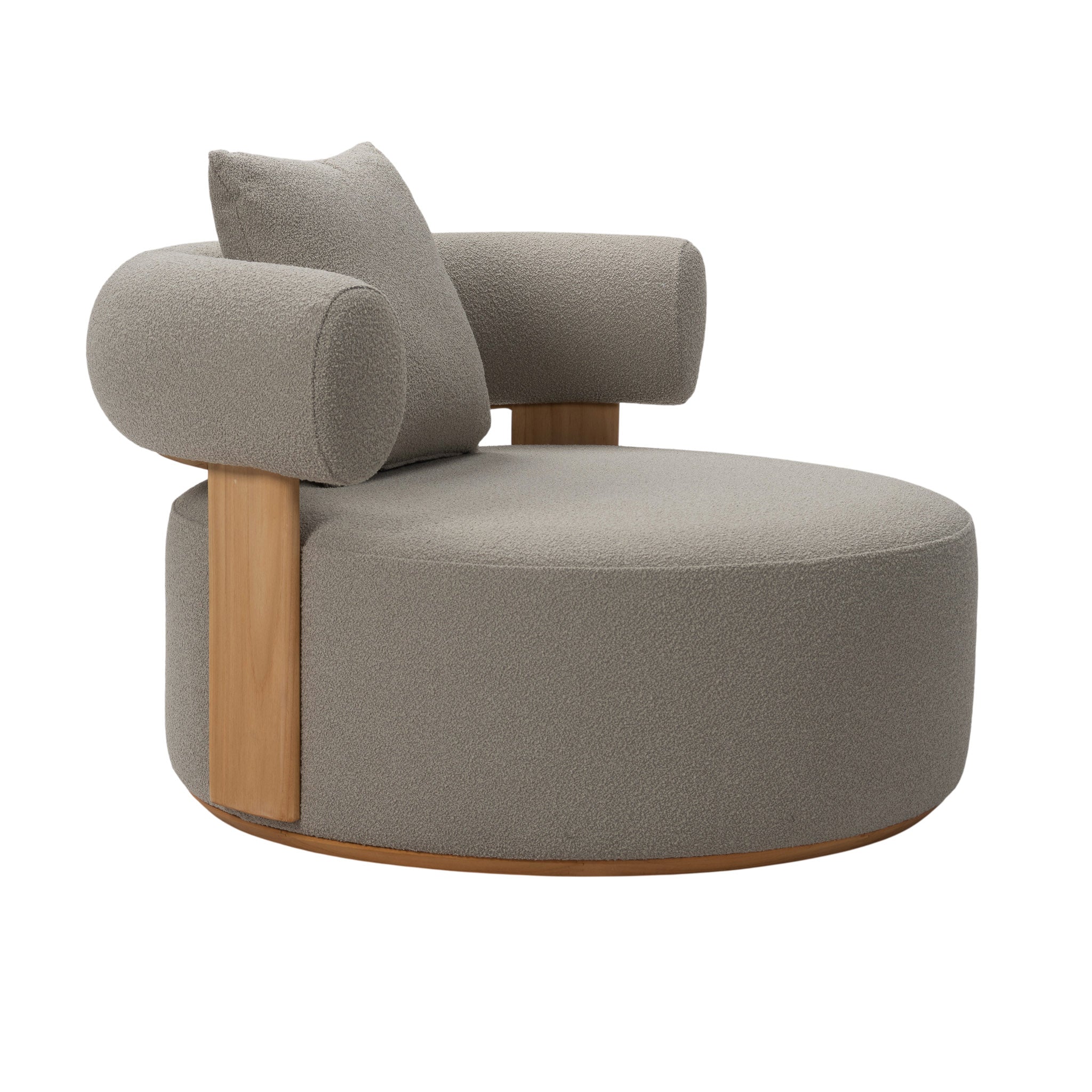 Front angle view of Cap Ferrat teak lounge chair with round seating and armrest with plush seating fabric and on back arm rest with pillow cushion. 