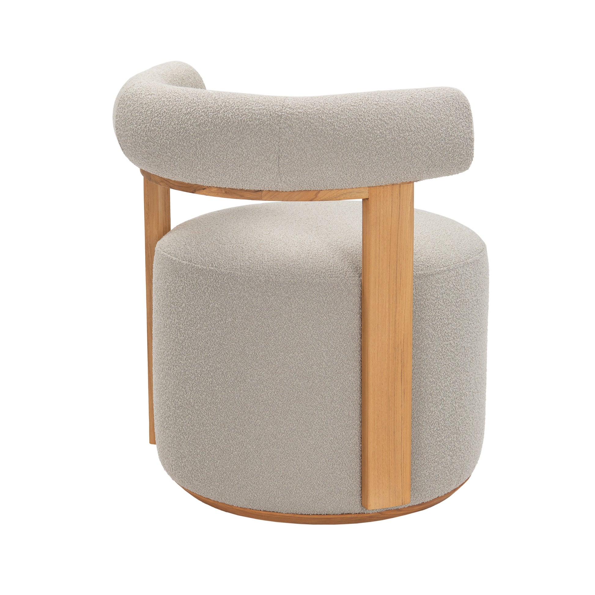 Rear angle view of Cap Ferrat teak round dining chair with teak wood frame covered in plush cushion fabric on back arm and seating.