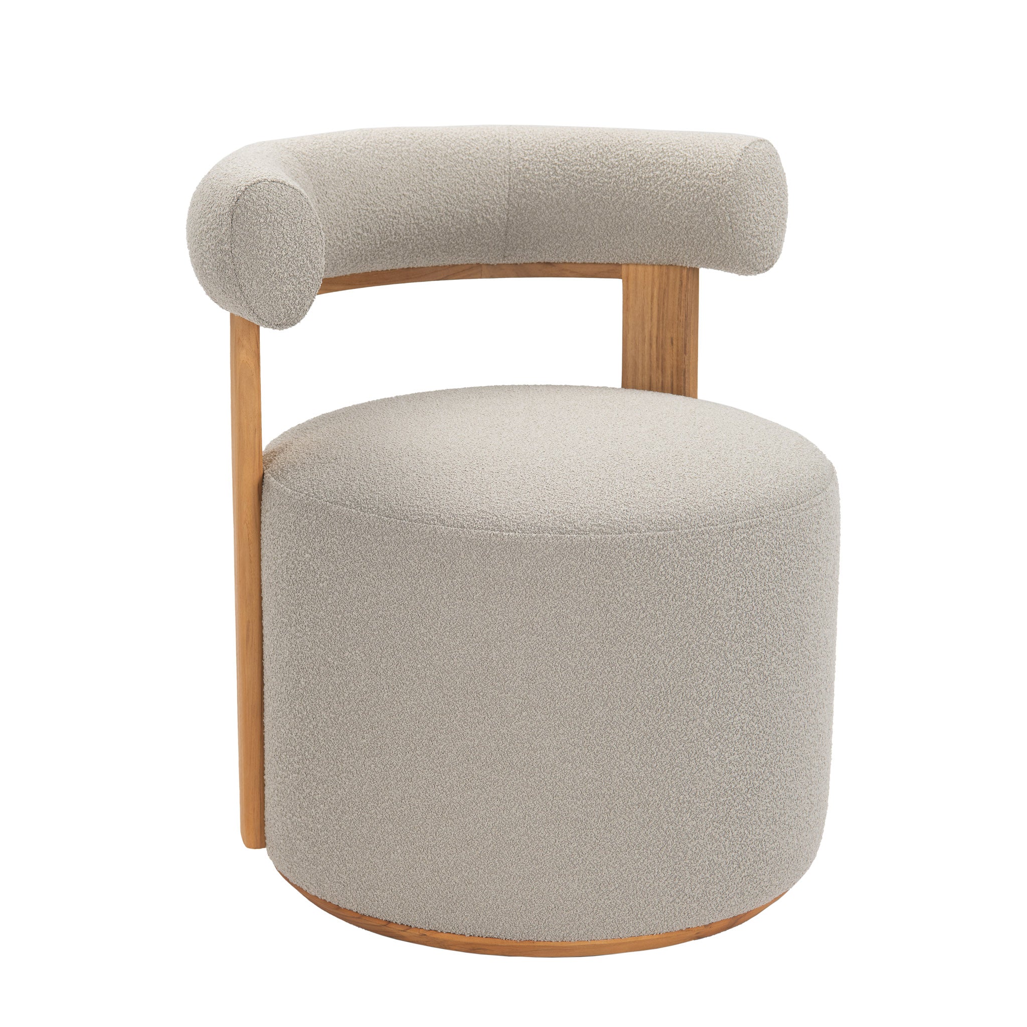 Front angle view of Cap Ferrat teak round dining chair with teak wood frame covered in plush cushion fabric on back arm and seating.