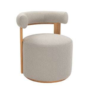 Front angle view of Cap Ferrat teak round dining chair with teak wood frame covered in plush cushion fabric on back arm and seating.