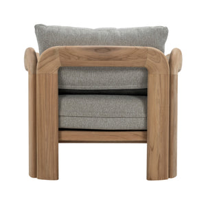 Rear view of Caribbean outdoor lounge chair showing solid teak construction, curved armrests and natural timber grain