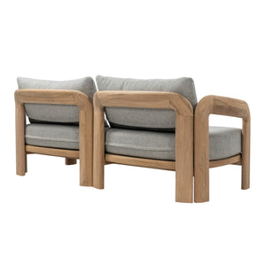 Rear angled view of Caribbean teak outdoor sofa showing natural timber frame and backrest construction