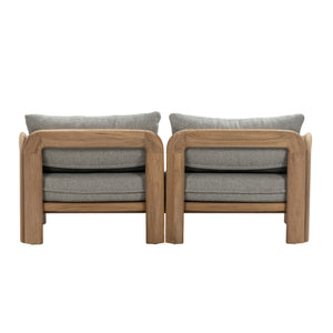 Rear view of Caribbean outdoor two-seater sofa showing solid teak frame, curved armrests and exposed timber grain