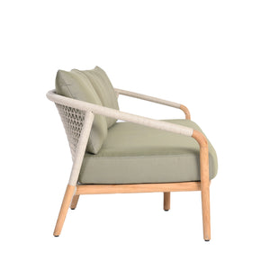 Catalina outdoor teak and rope 3-seater sofa with teak wood frame, outdoor rope weaving and deep plush seating and back cushions in light green. Side view.