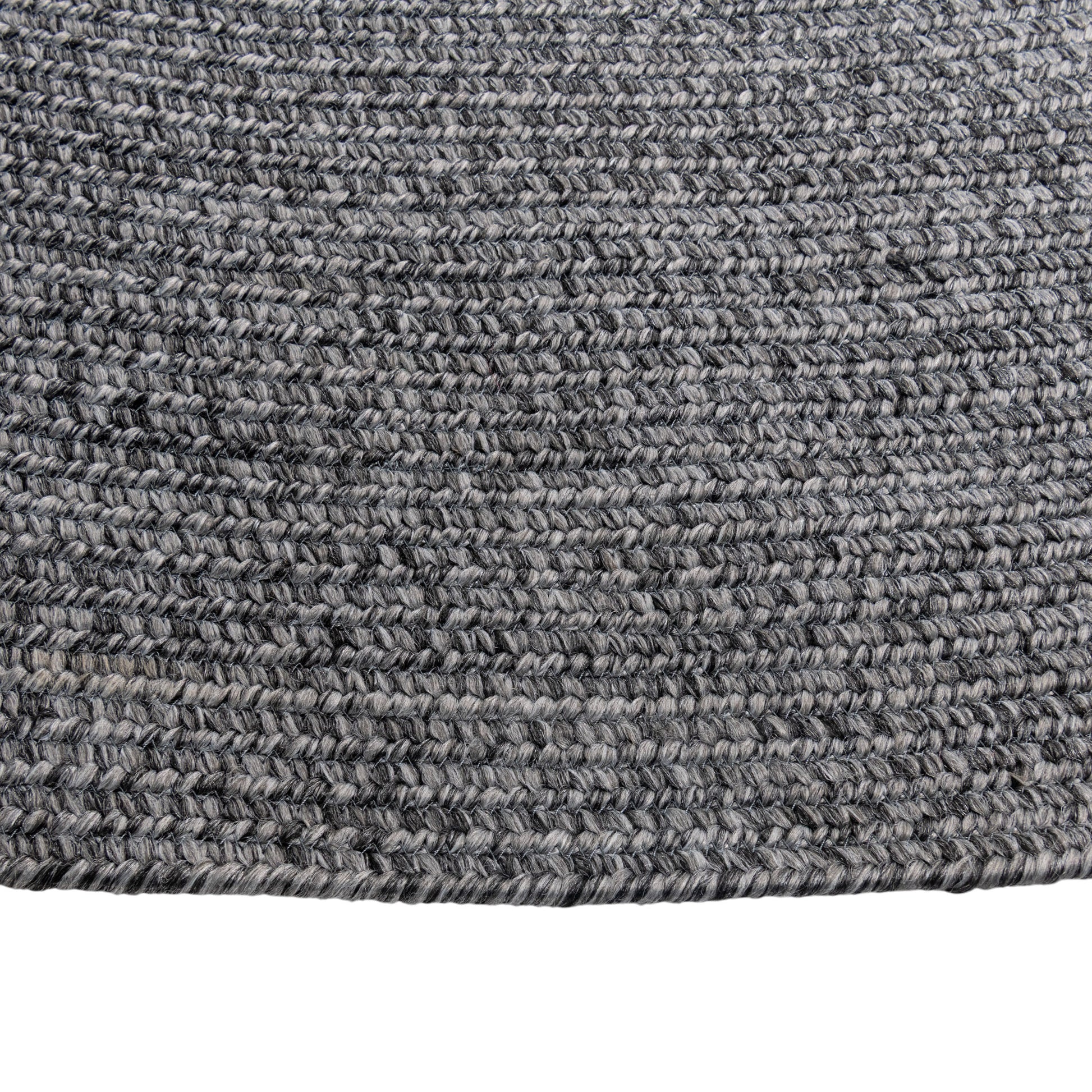 Cirra outdoor round handwoven floor rug in dark gray closeup.