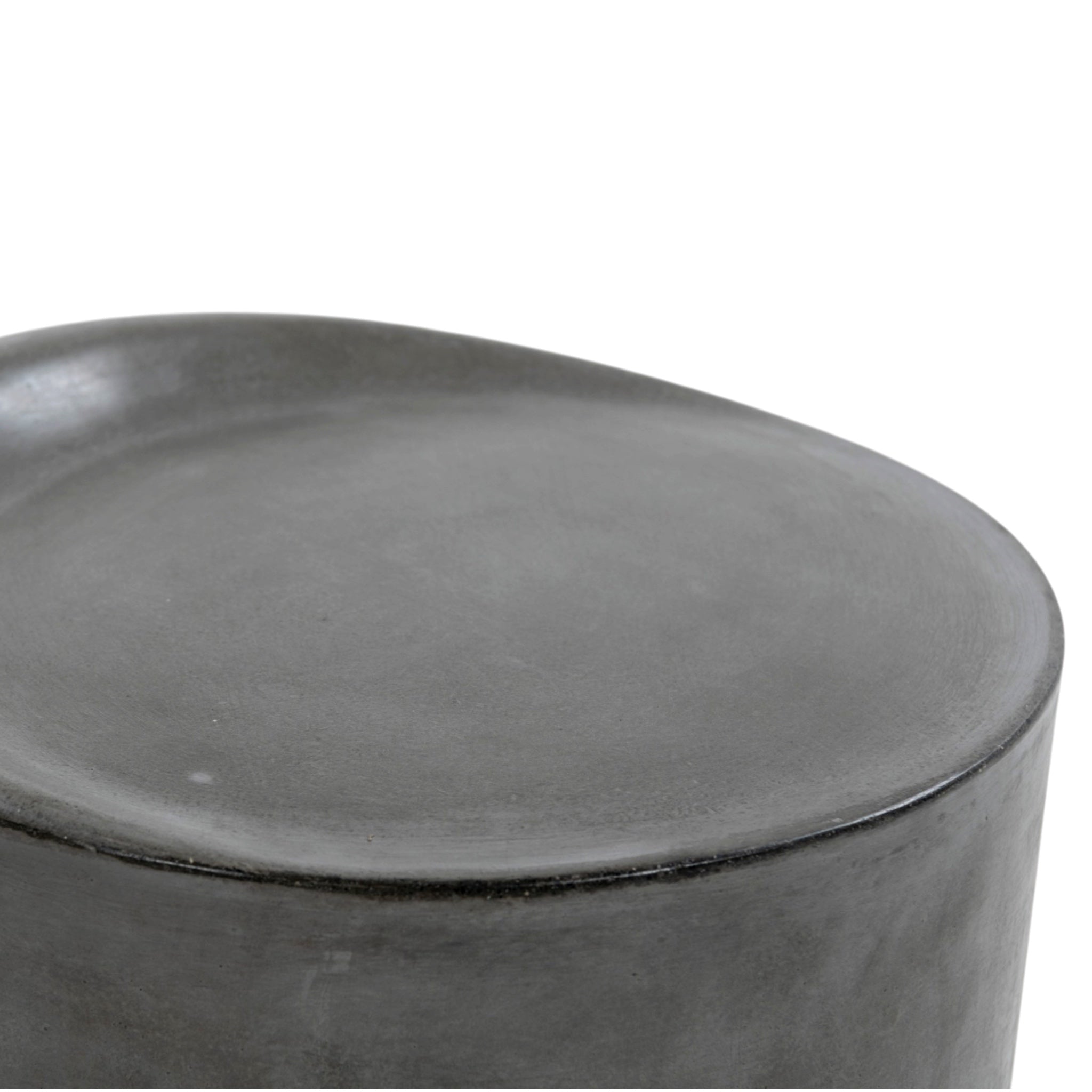Close-up of a dark gray concrete stool with a smooth, matte finish on a plain white background.