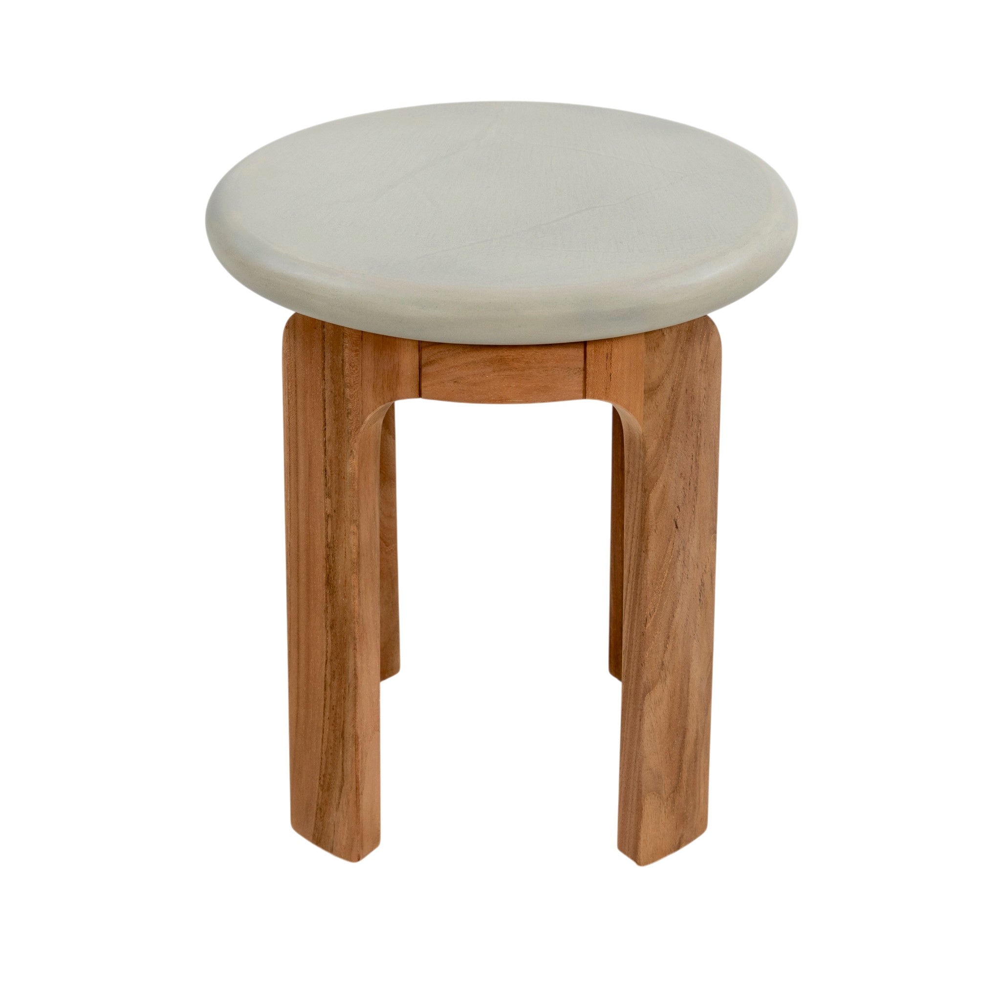 Three-quarter view of round concrete outdoor side table with natural teak legs and curved frame
