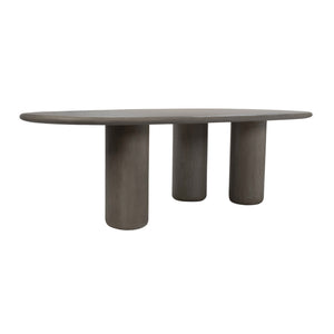 Back angle view of grey concrete dining table with cylindrical base
