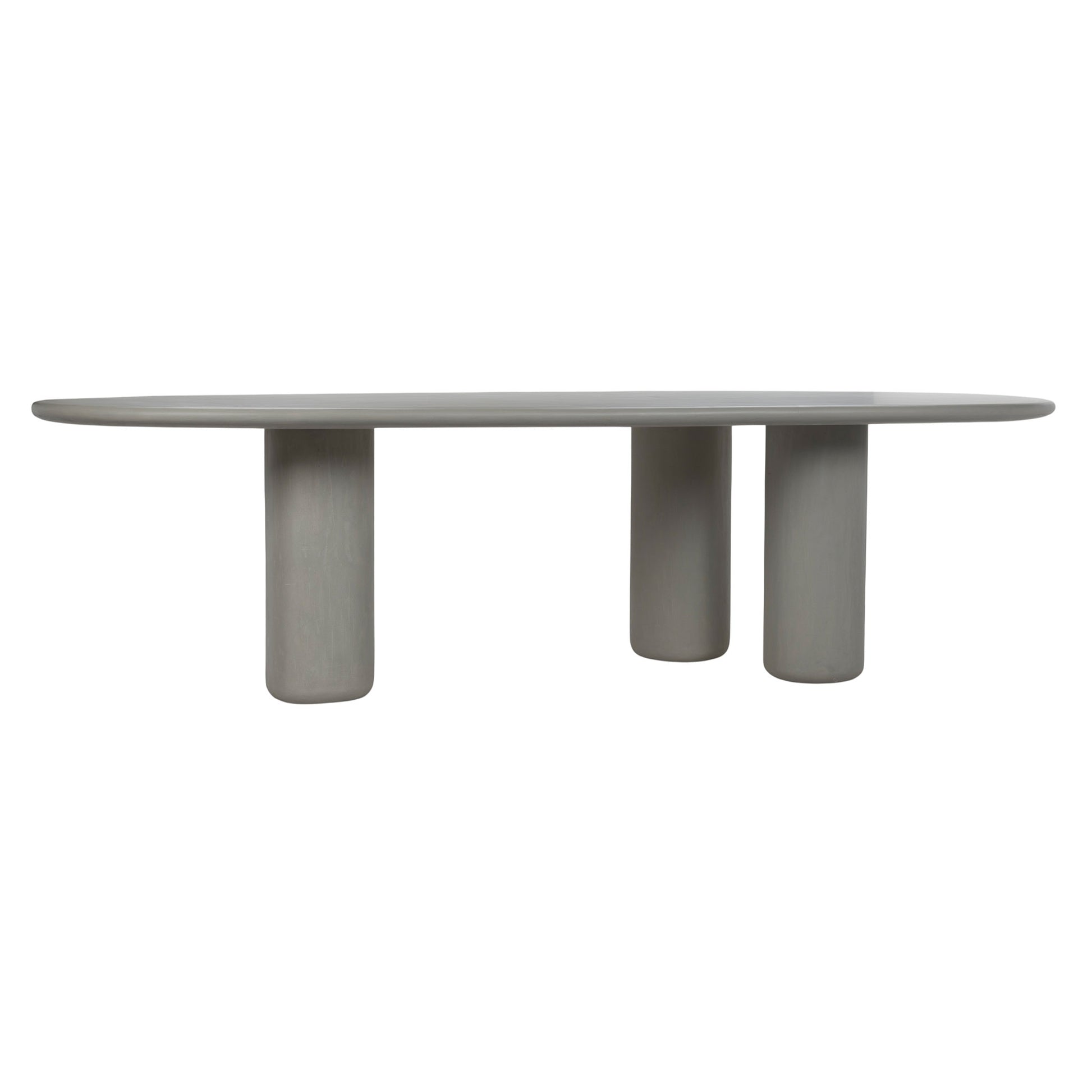 Front view of Curve outdoor concrete dining table with there cylindrical legs. 