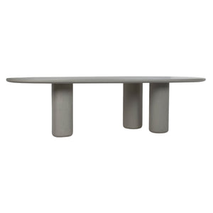 Front view of Curve outdoor concrete dining table with there cylindrical legs. 