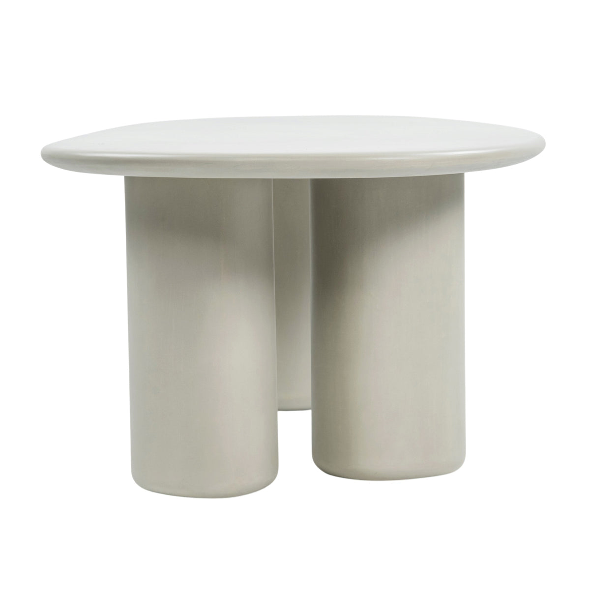 End view of Triad 215 cm concrete low dining table in Linen with three cylindrical pedestal legs