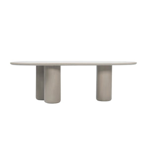 Side view of Triad 215 cm low dining table in Wasabi showing rounded tabletop and cylindrical supports