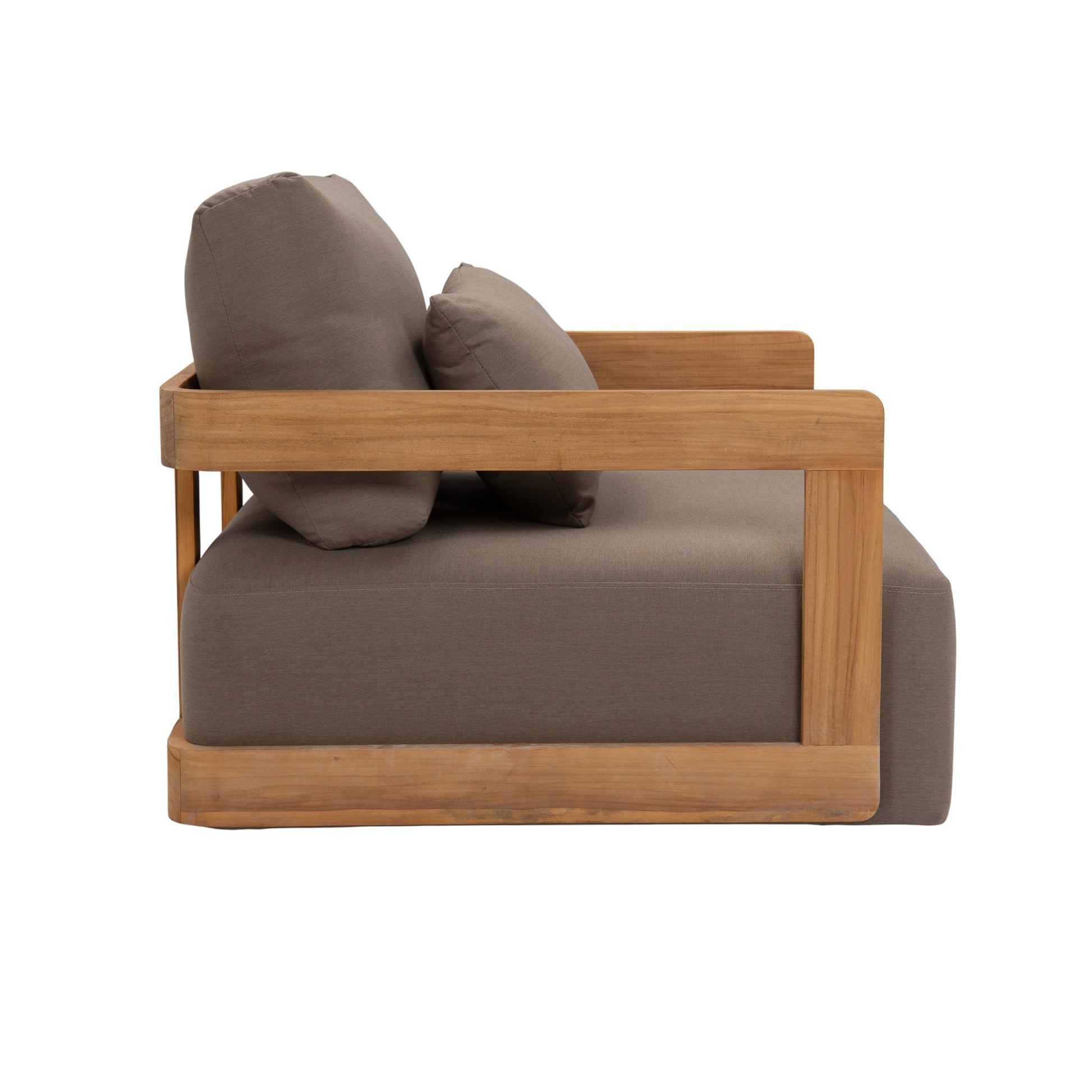 Franco teak lounge chair with deep seating and back cushions including a back pillow cushion. Side view.
