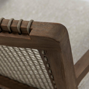 Close-up of Gazzoni lounge chair showing woven rope detailing secured around the teak backrest frame
