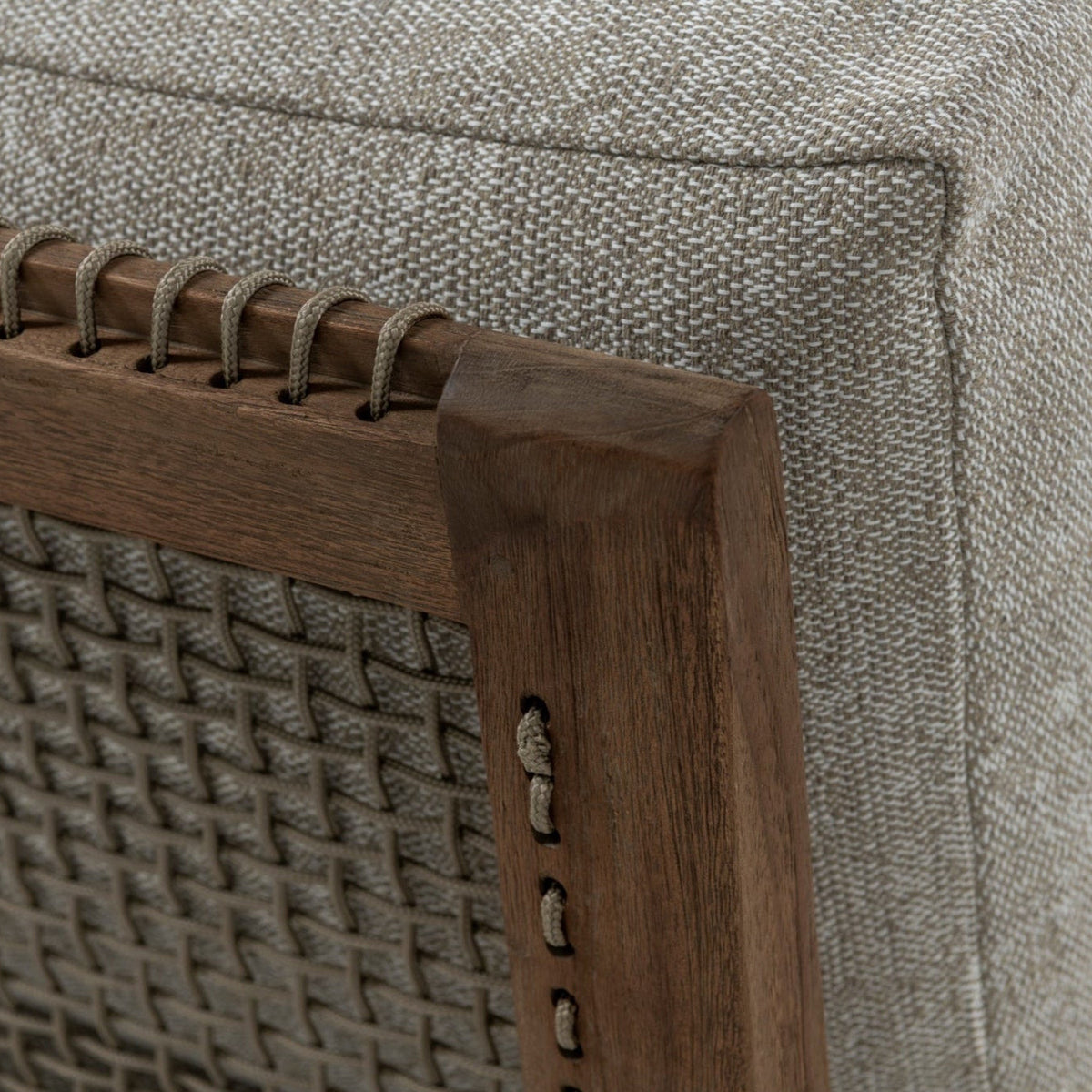 Close-up of Gazzoni centre chair showing woven detailing, reclaimed teak frame and Raffia Clay cushion fabric