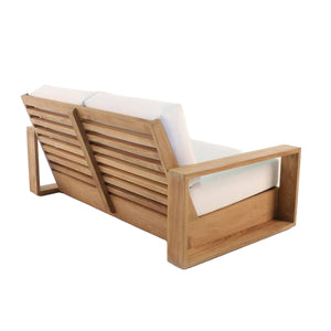 Kuba 2-seater sofa with wide planks of teak wood frame and deep seating cushions. Rear angle view.