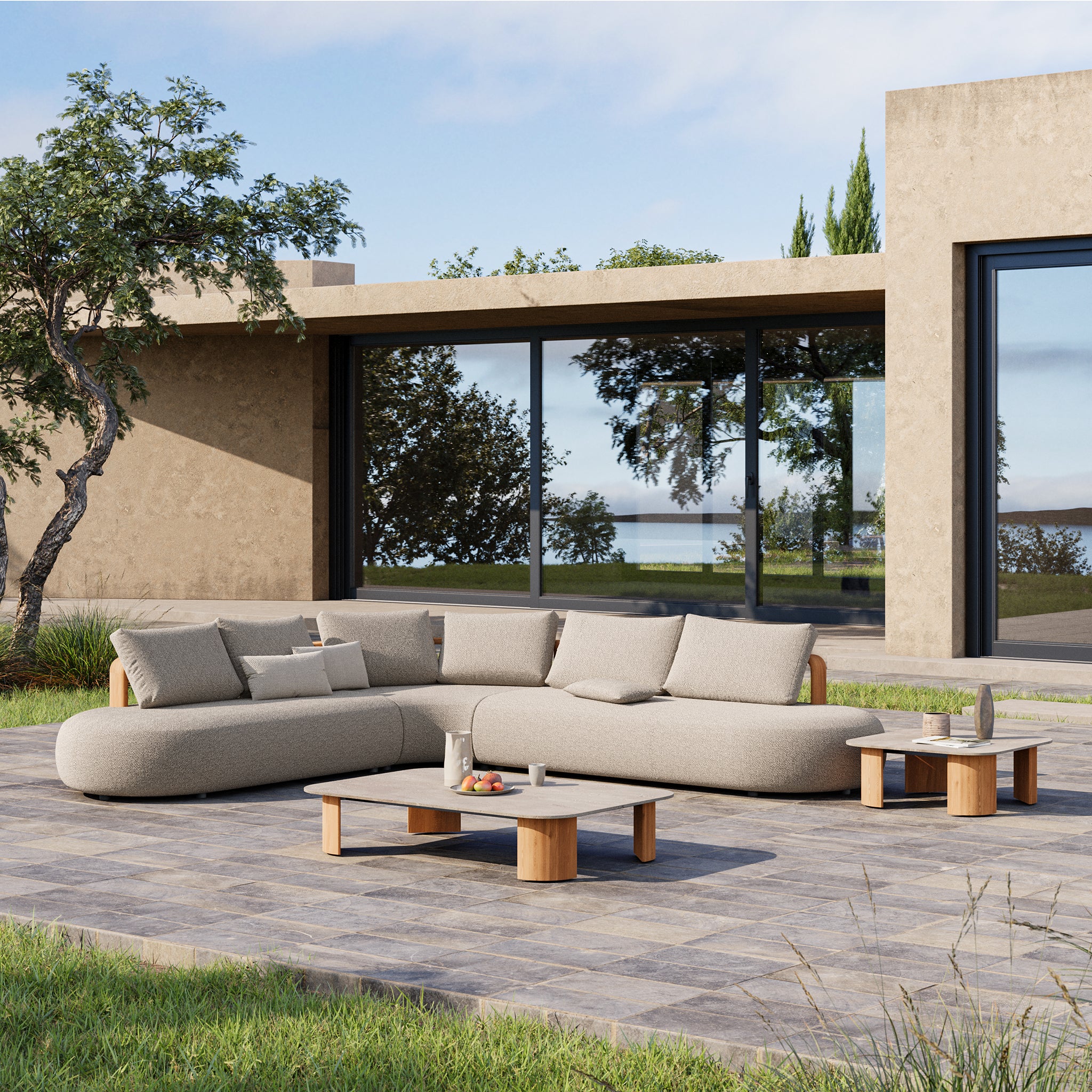 Larvotto teak modular furniture collection in situ in front of house on patio. 