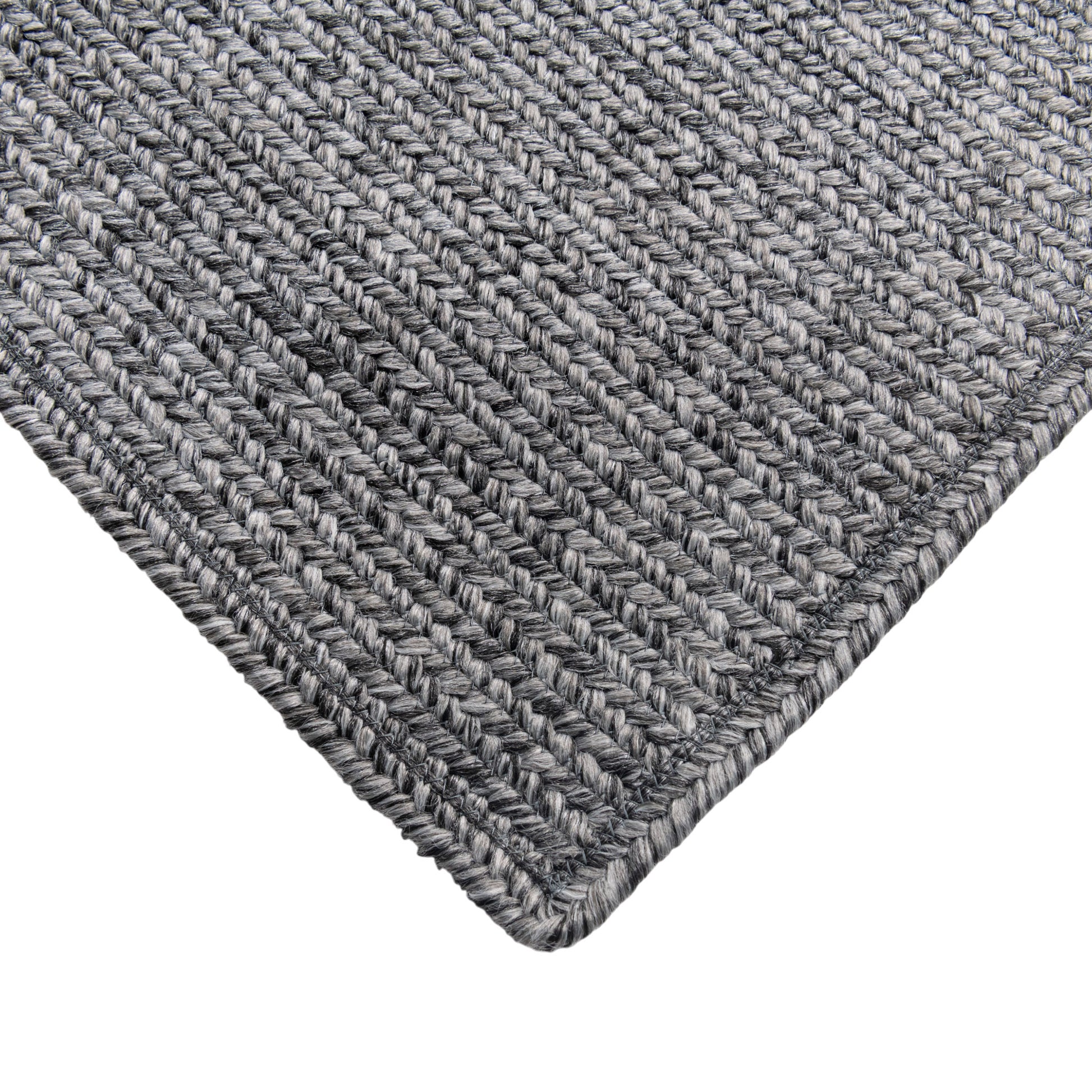 Dark and light grey Linda outdoor handwoven rug closeup view.