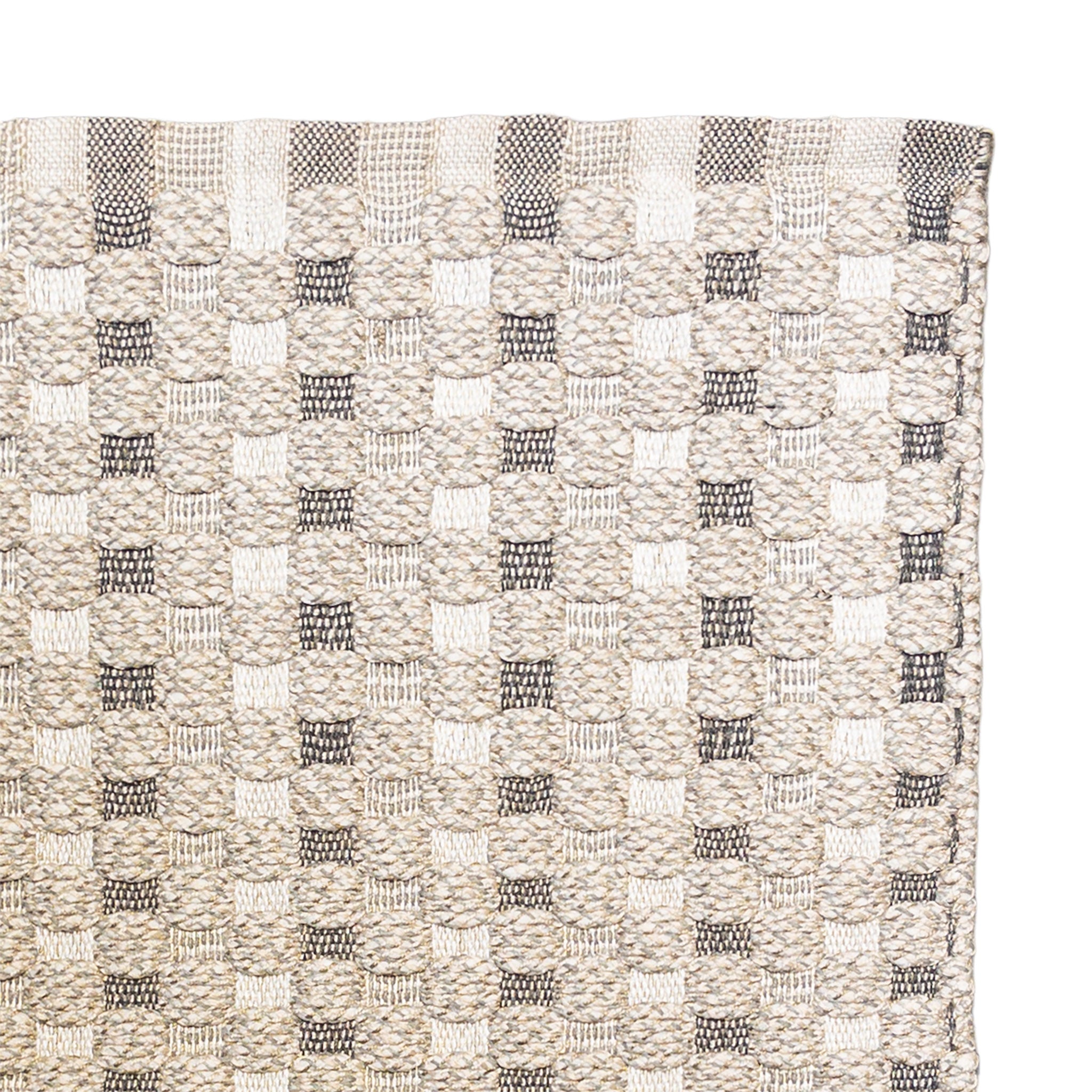 Textured woven pattern with black and beige colors on a white background