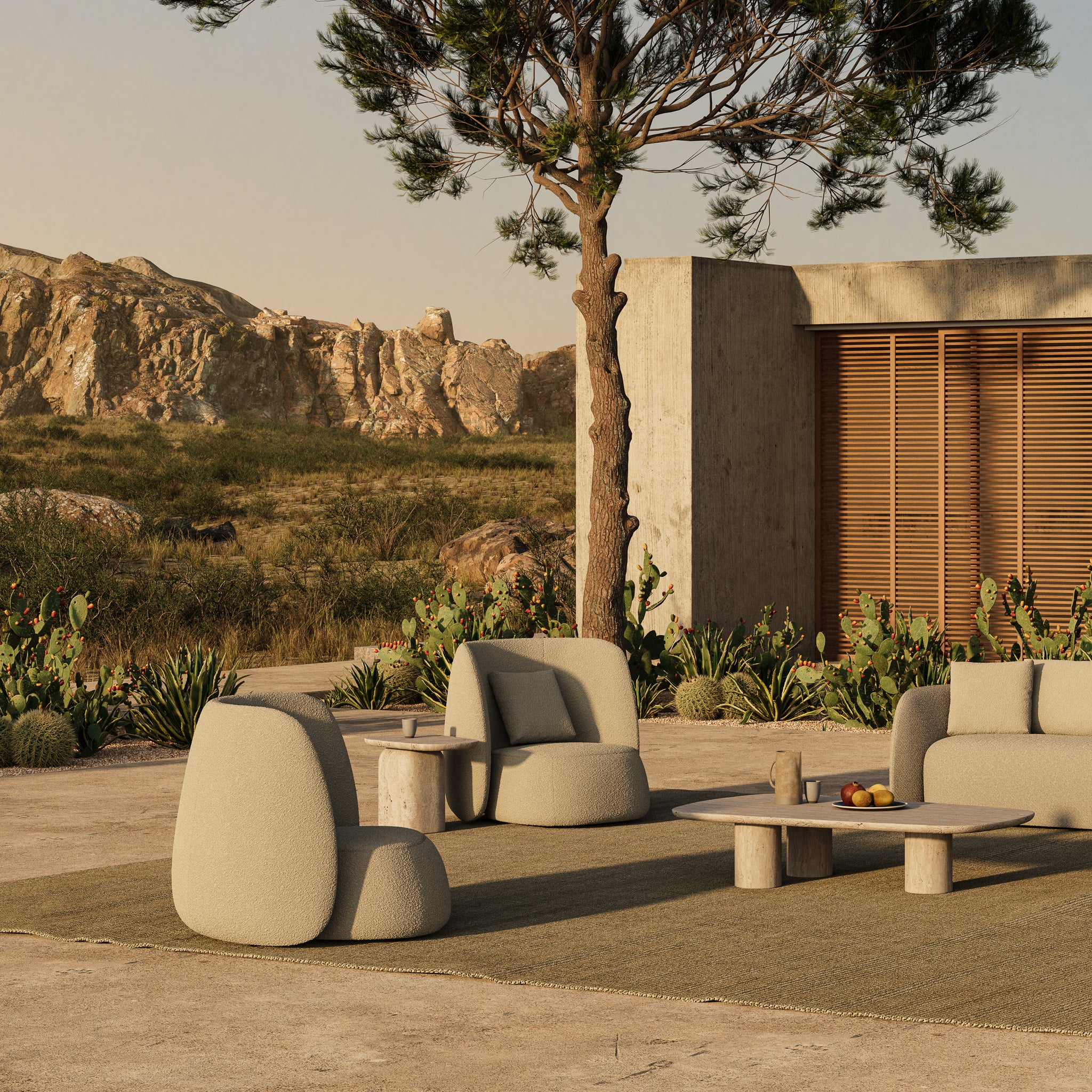 Two Monaco high back lounge chairs on a patio with desert and house as backdrop