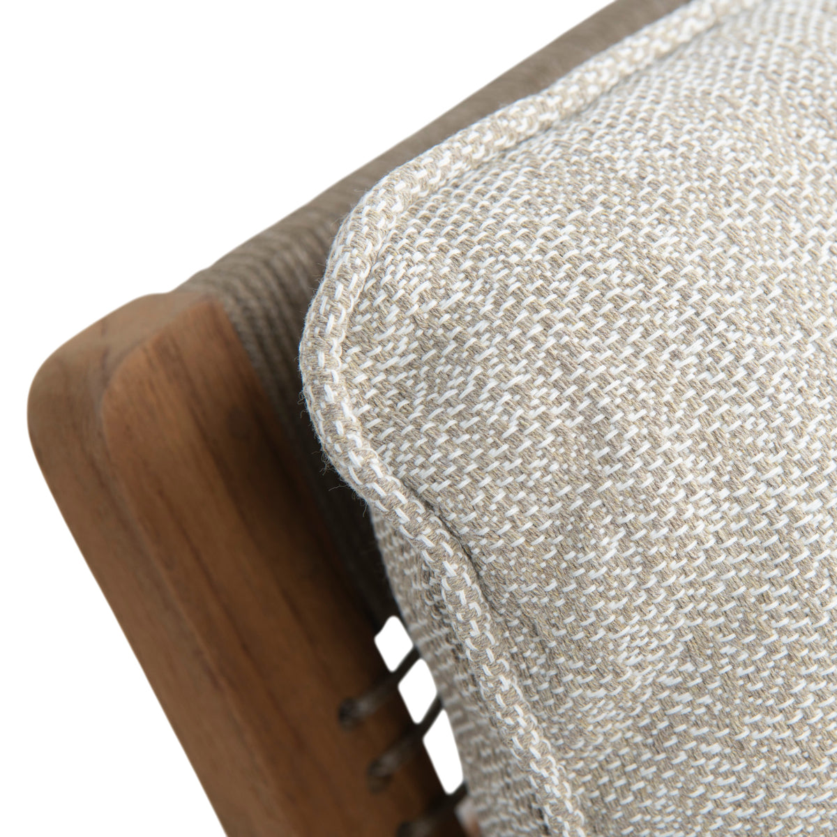 Close-up detail of a woven beige and white textured cushion with a wooden frame edge visible against a white background.
