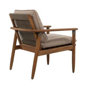 A mid-century modern accent chair with a warm brown wooden frame, woven rope backrest, and light beige textured cushions, shown from a three-quarters angle on a white background.