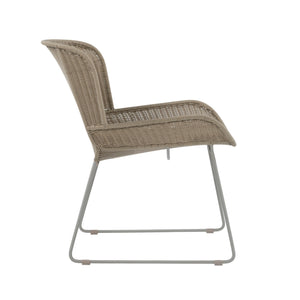 Nairobi Pure Wicker Lounge Chair in Greige / Linen with curved synthetic wicker seat, wraparound backrest and powder-coated aluminium legs. Side view.
