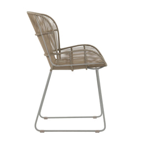 Nairobi Woven Dining Armchair in Greige / Linen, featuring a curved synthetic wicker seat and backrest with a coordinating metal sled-style frame. Side view.