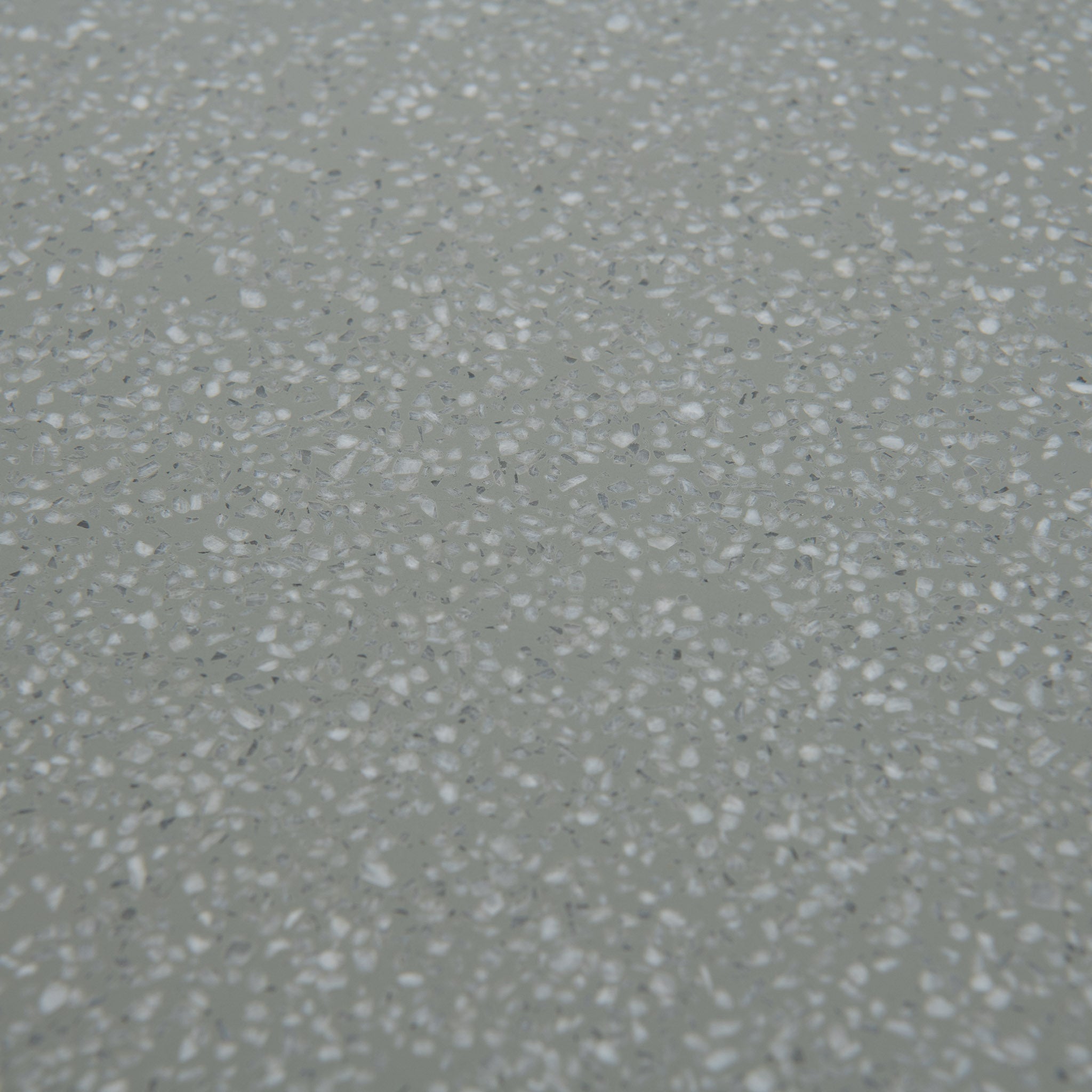 Closeup of Naxos outdoor dining table top in green with accents in white dots