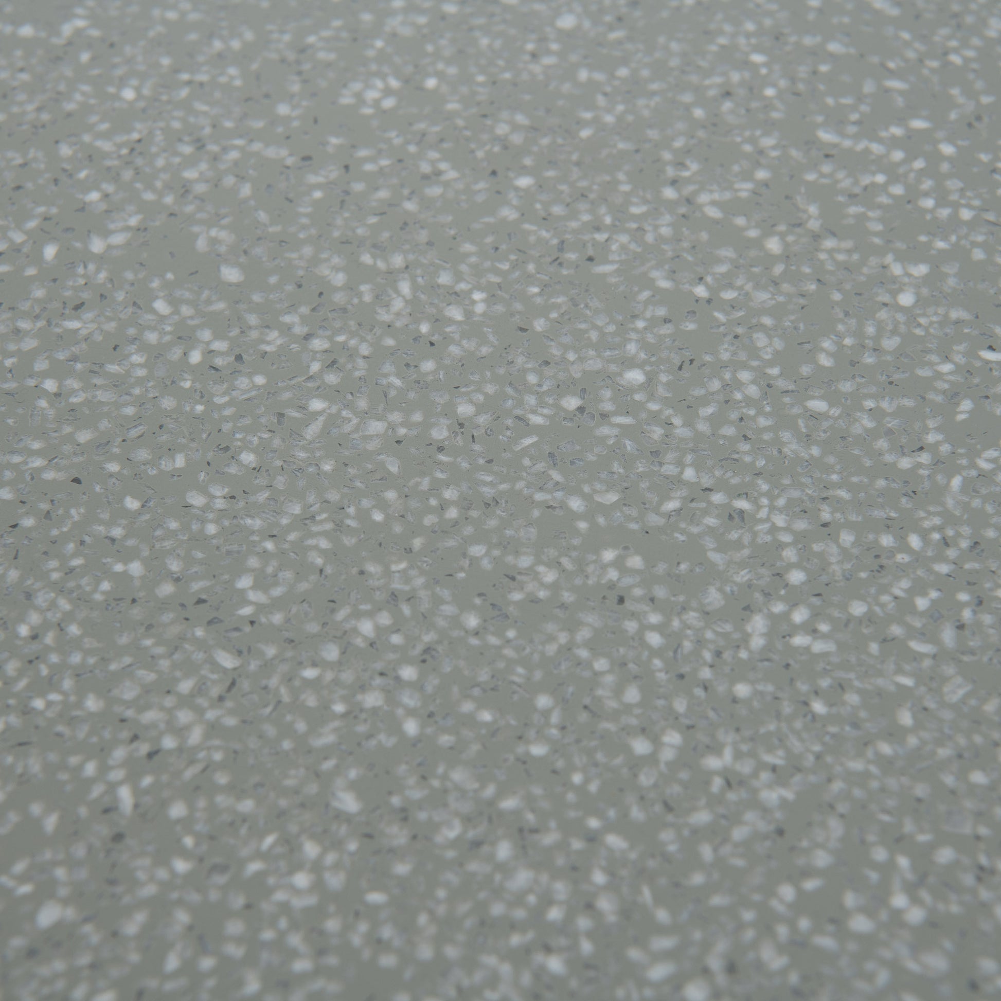 Closeup of Naxos outdoor dining table top in green with accents in white dots