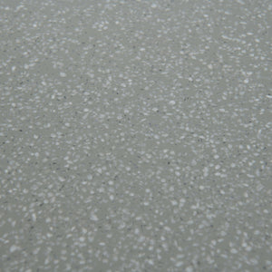 Closeup of Naxos outdoor dining table top in green with accents in white dots