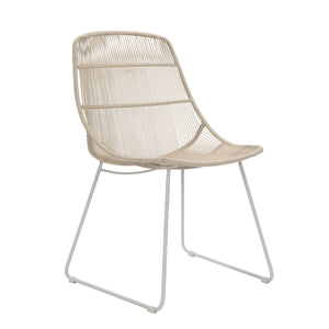 Oliver outdoor wicker dining side chair with linen coloured frame and weave. Front angle view.