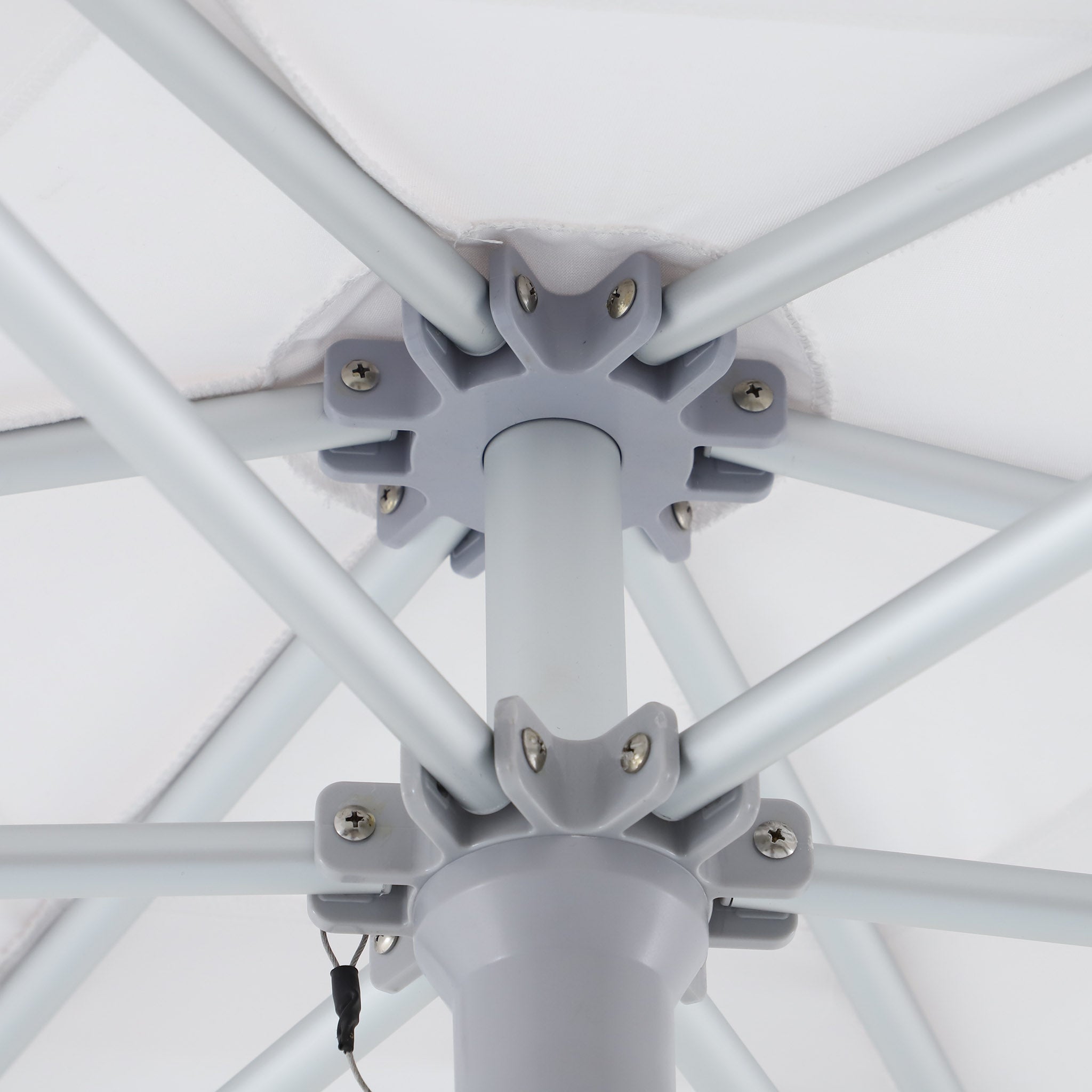 Close-up of the umbrella hub showing the internal aluminium rib structure and connection points.