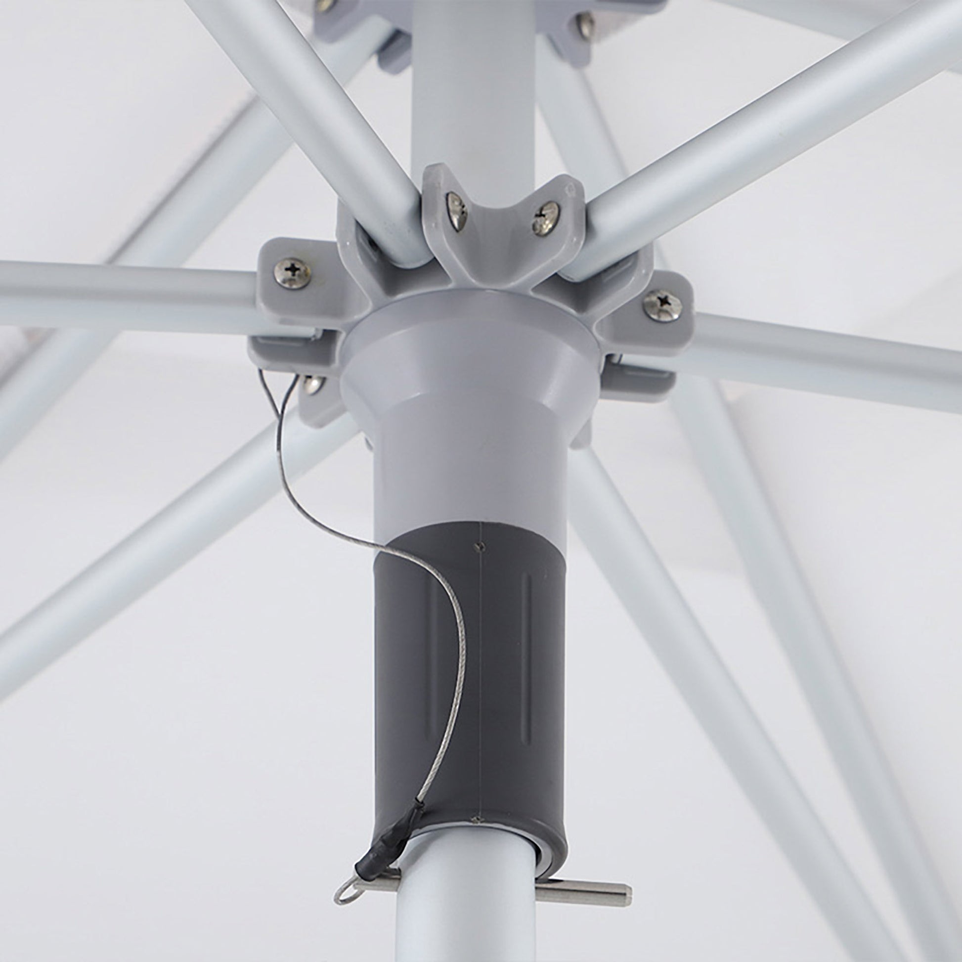 Detail view of the umbrella’s central hub and rib arms, highlighting the reinforced frame design.