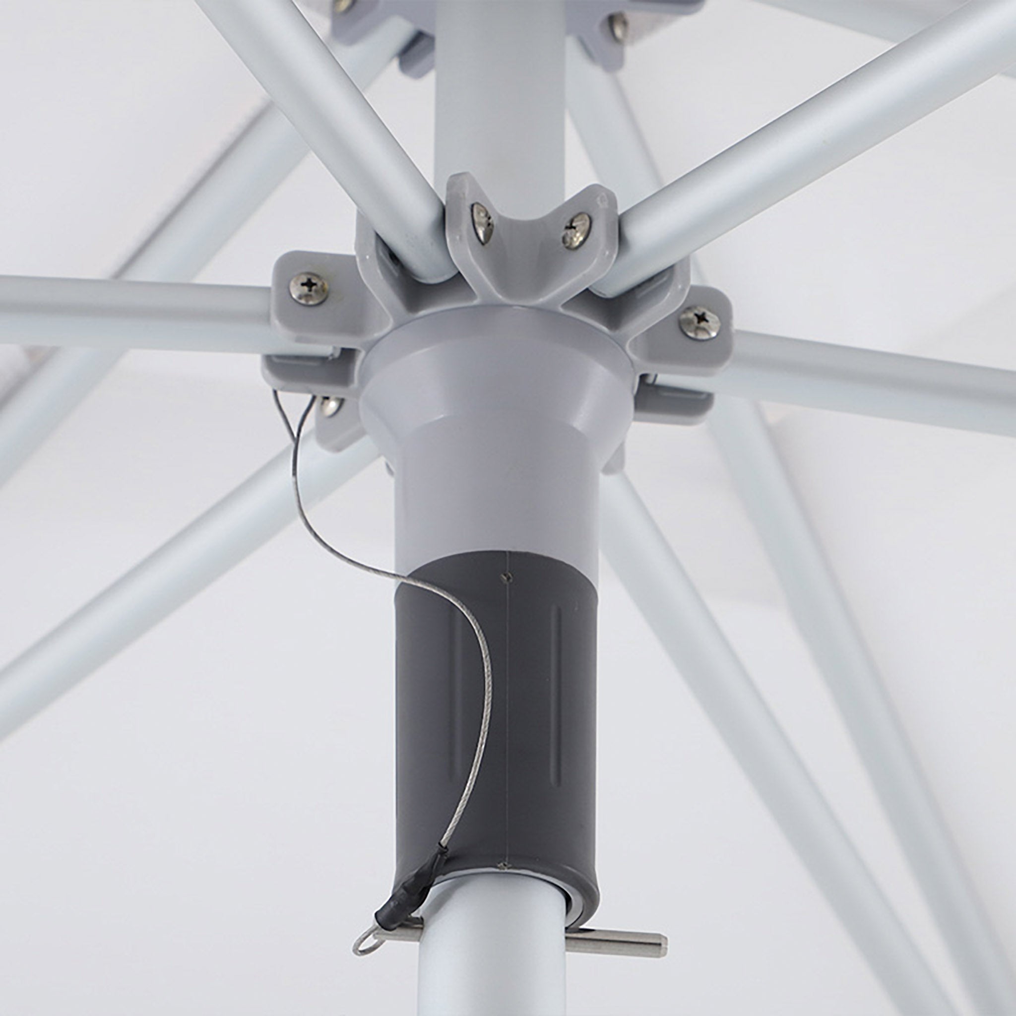 Detail view of the umbrella’s central hub and rib arms, highlighting the reinforced frame design.