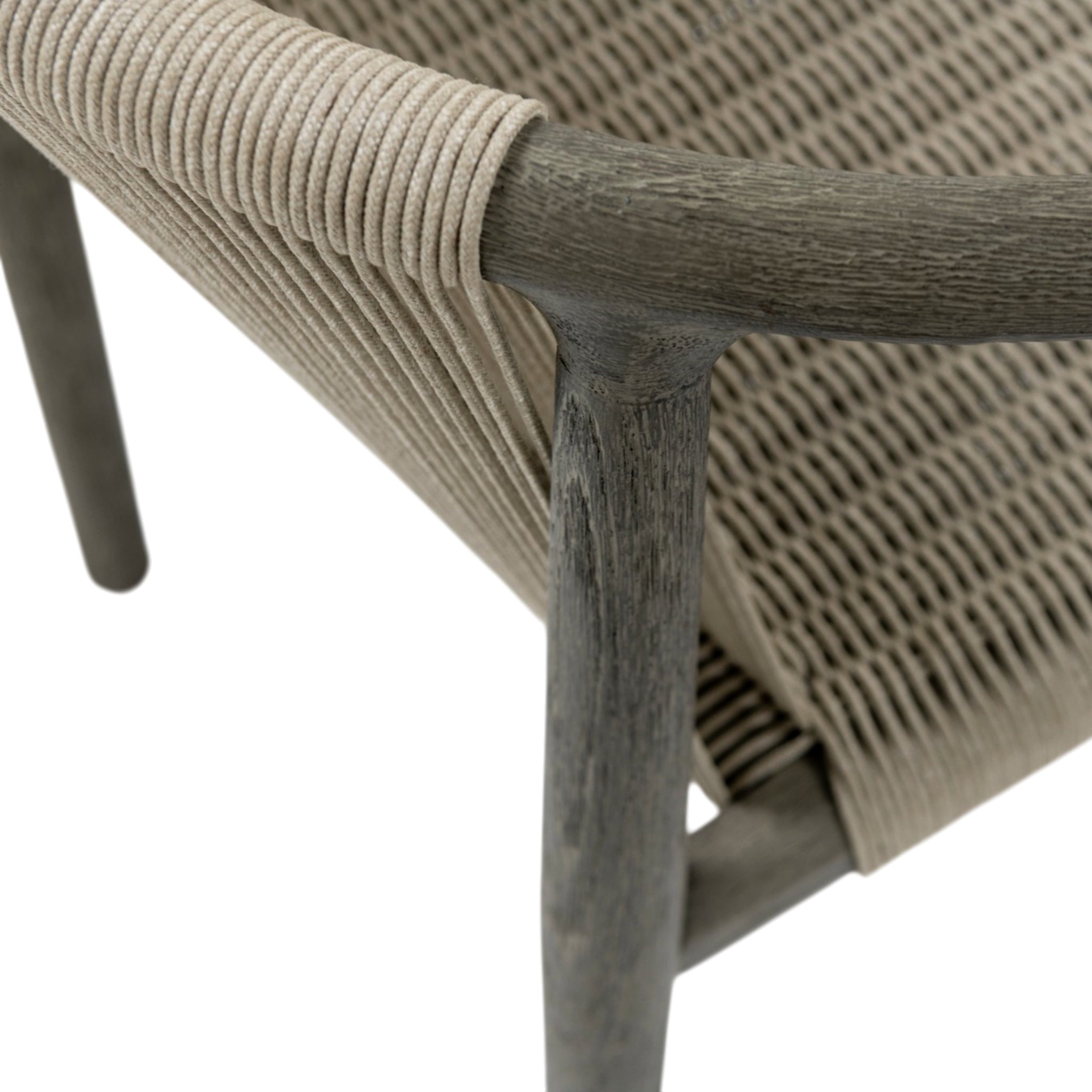 Close-up of Palma teak dining armchair showing natural-coloured rope weaving wrapped around the weathered timber frame