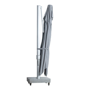 Portofino square cantilever umbrella with large grey canopy collapsed for convenient storage.