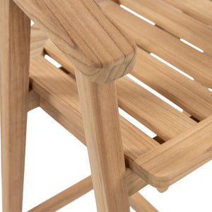 Close-up detail of a light natural wood slatted chair or stool, showing the armrest, leg, and seat slats on a white background.