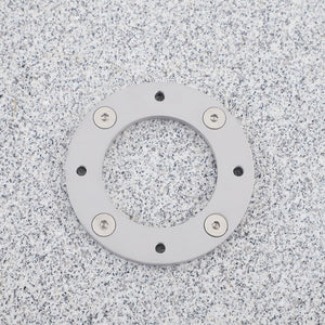 Closeup of square granite stone umbrella base with wheels for cantilever umbrellas. 