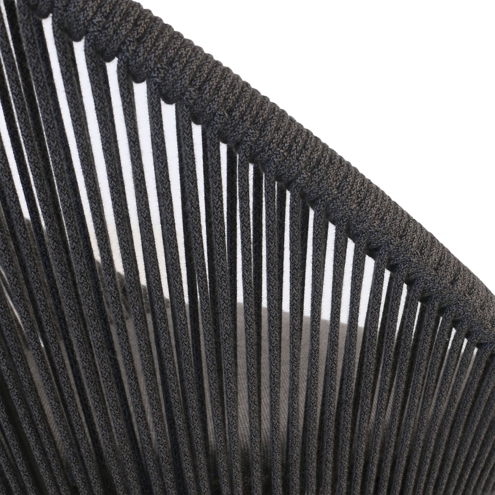 Closeup of woven rope on back and seat of outdoor dining chair. 