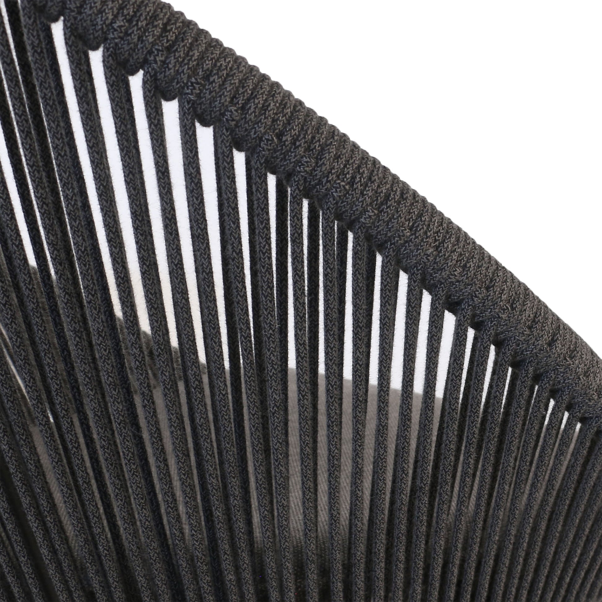 Closeup of woven rope on back and seat of outdoor dining chair. 